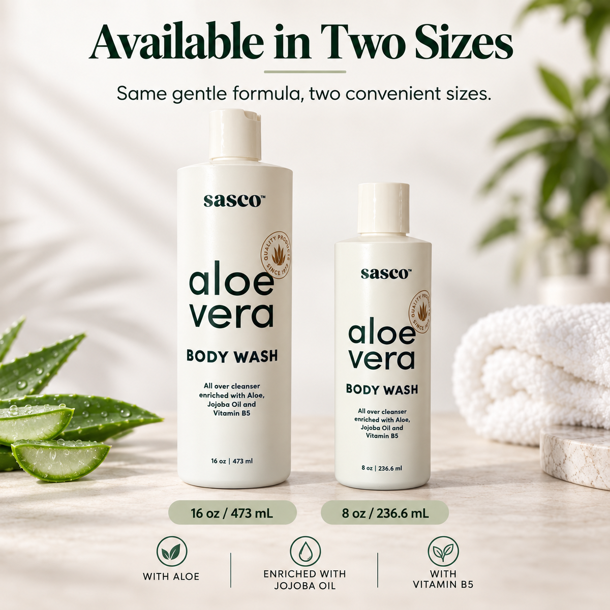 Two white Sasco Aloe Vera Body Wash bottles shown in two sizes (16 oz and 8 oz) on a light marble surface with aloe vera leaves and a folded white towel in the background. Text at the top reads 'Available in Two Sizes' and the bottom features feature icons.